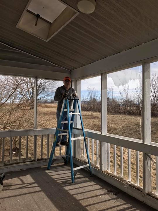 John and Andrew took screens off back porch!
